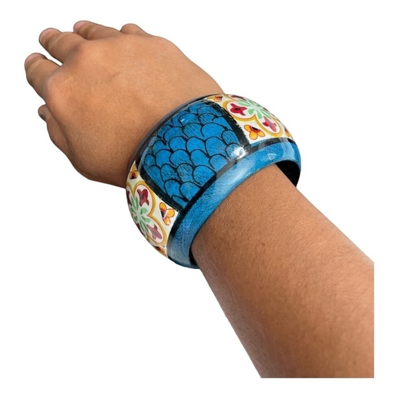 Wooden hand painted bangle. Colors of blue, red, yellow, green, and white. - Picture 2 of 8